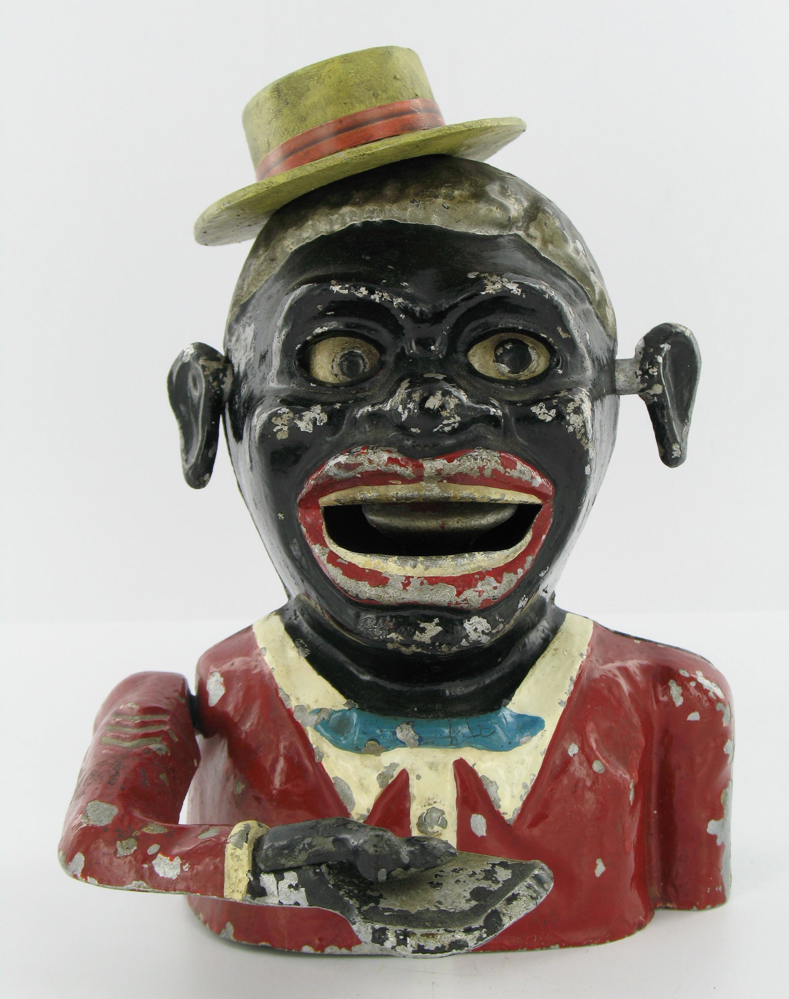 Jolly Man Sonny Boy with Hat Mechanical Bank: Made by Robert Starkies, Aluminum. Circa 1945. Eyes move down, silver hair, raised chevrons on arm and lattice base. "Patent 601362" embossed inside the back piece. Lattice embossed "Starkies Patent 3