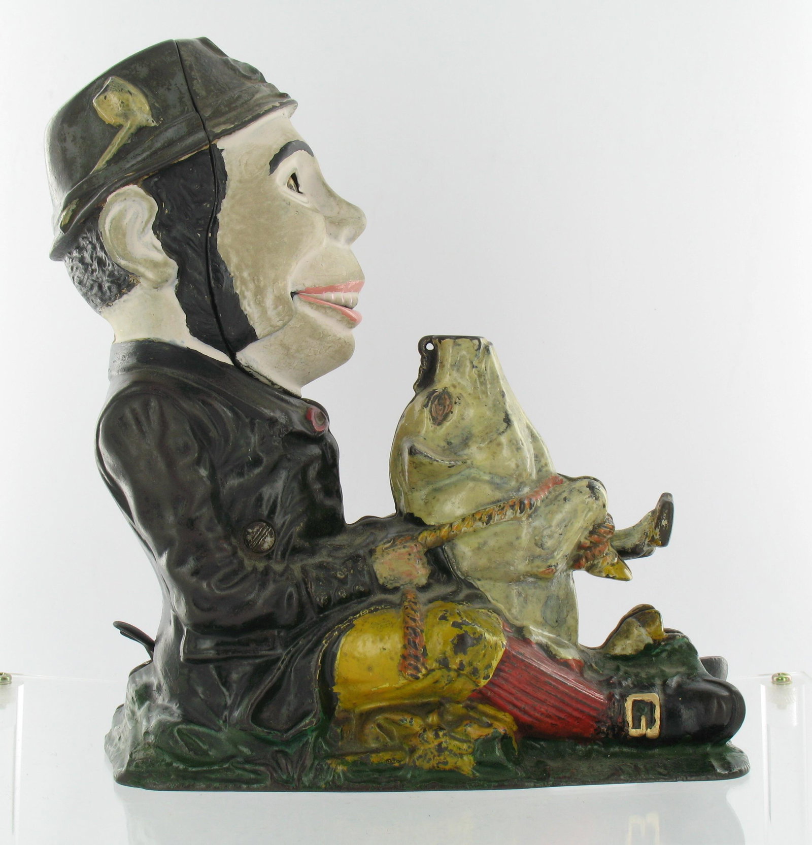 Paddy and the Pig Mechanical Bank: Made by J. & E. Stevens. Cromwell, Connecticut. Circa 1884. Cast Iron. With Blue Jacket and coin trap. Good Condition. Partially restored.