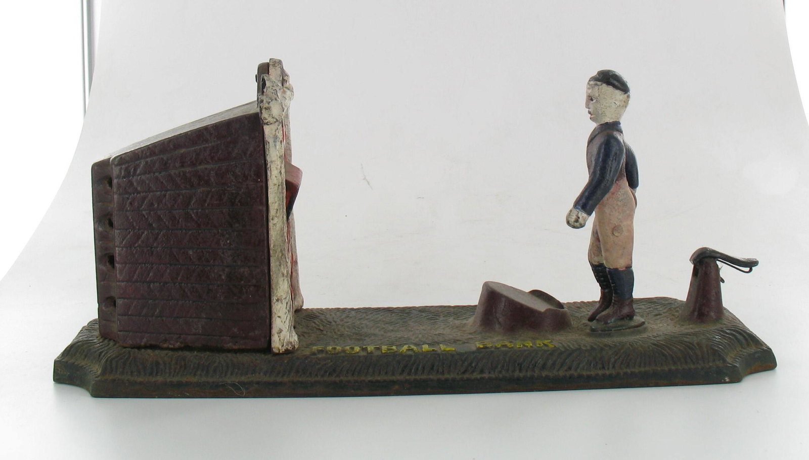 Football Bank: Made by Harper. Circa 1895. Original bank with replaced figure. Very Good Condition.