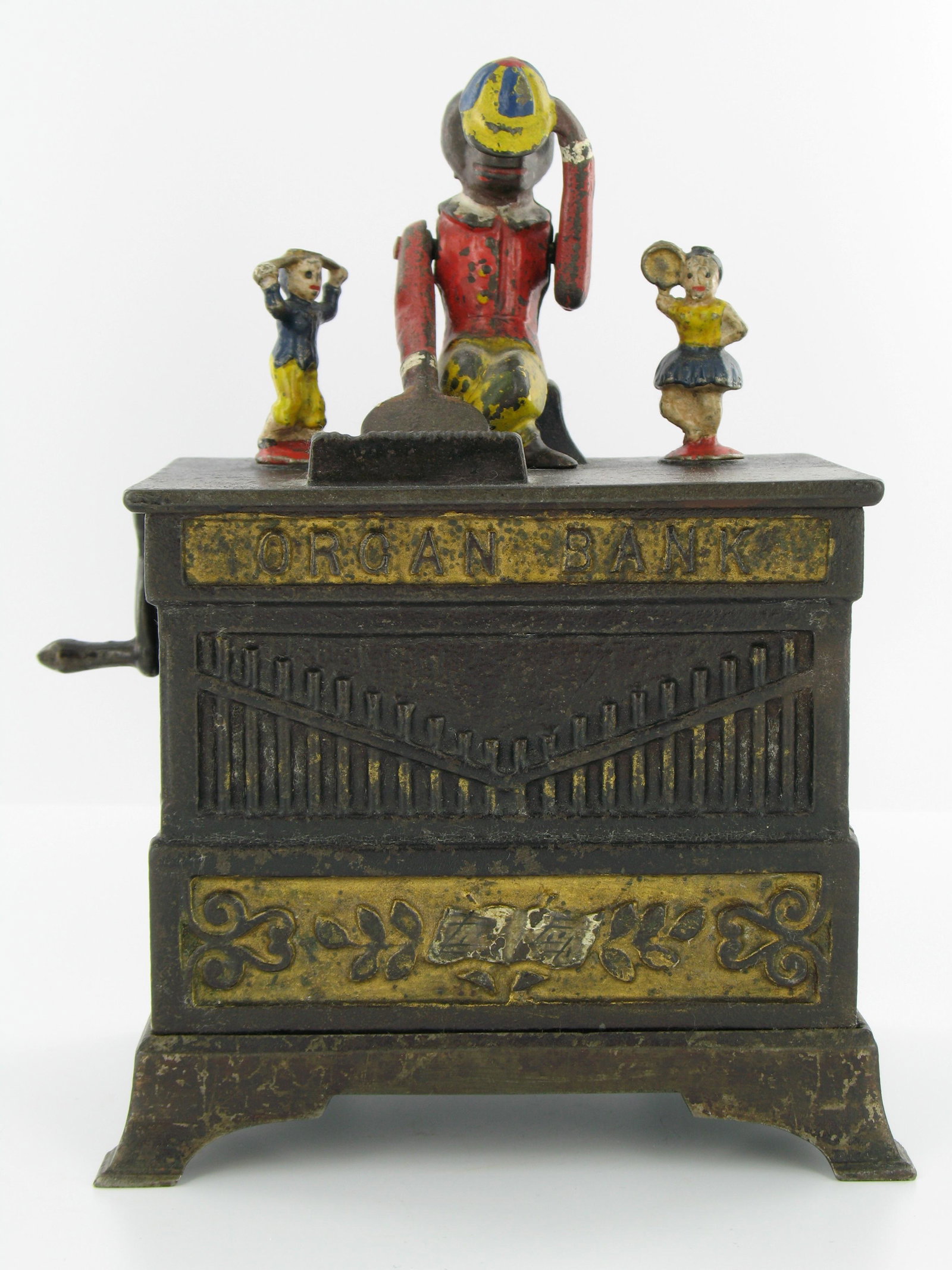 Organ Bank Boy and Girl Mechanical Bank: Made by the Kyser & Rex Company. Philadelphia, Pennsylvania. Circa 1882. Cast Iron. With locking trap and original key. Very Good Condition.