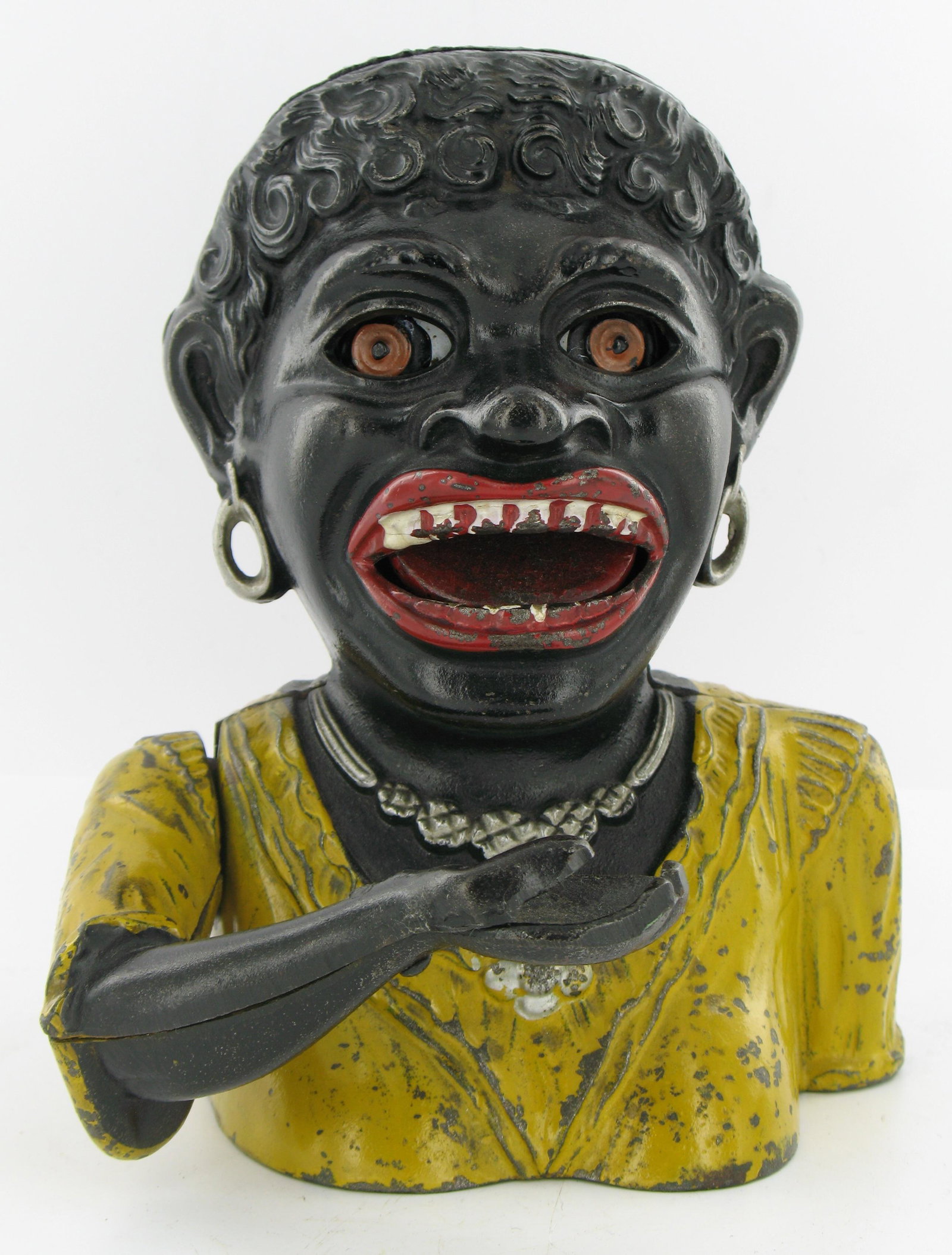 Dinah Short Sleeves Mechanical Bank: Made by John Harper. England. Cast arm and closed fingers with holed base. Excellent Condition.