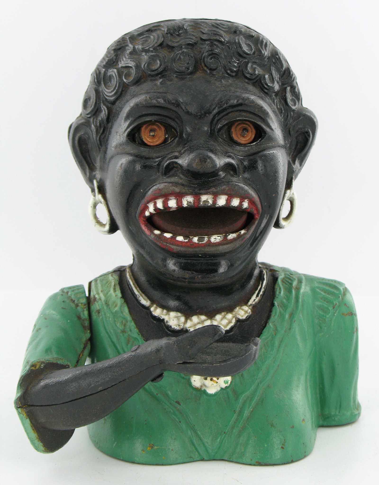 Dinah Short Sleeves Mechanical Bank: Made by John Harper. England. Cast arm and closed fingers with holed base. Early repaint to green, was yellow. Base screw and one ear screw are not originals. Good Condition.