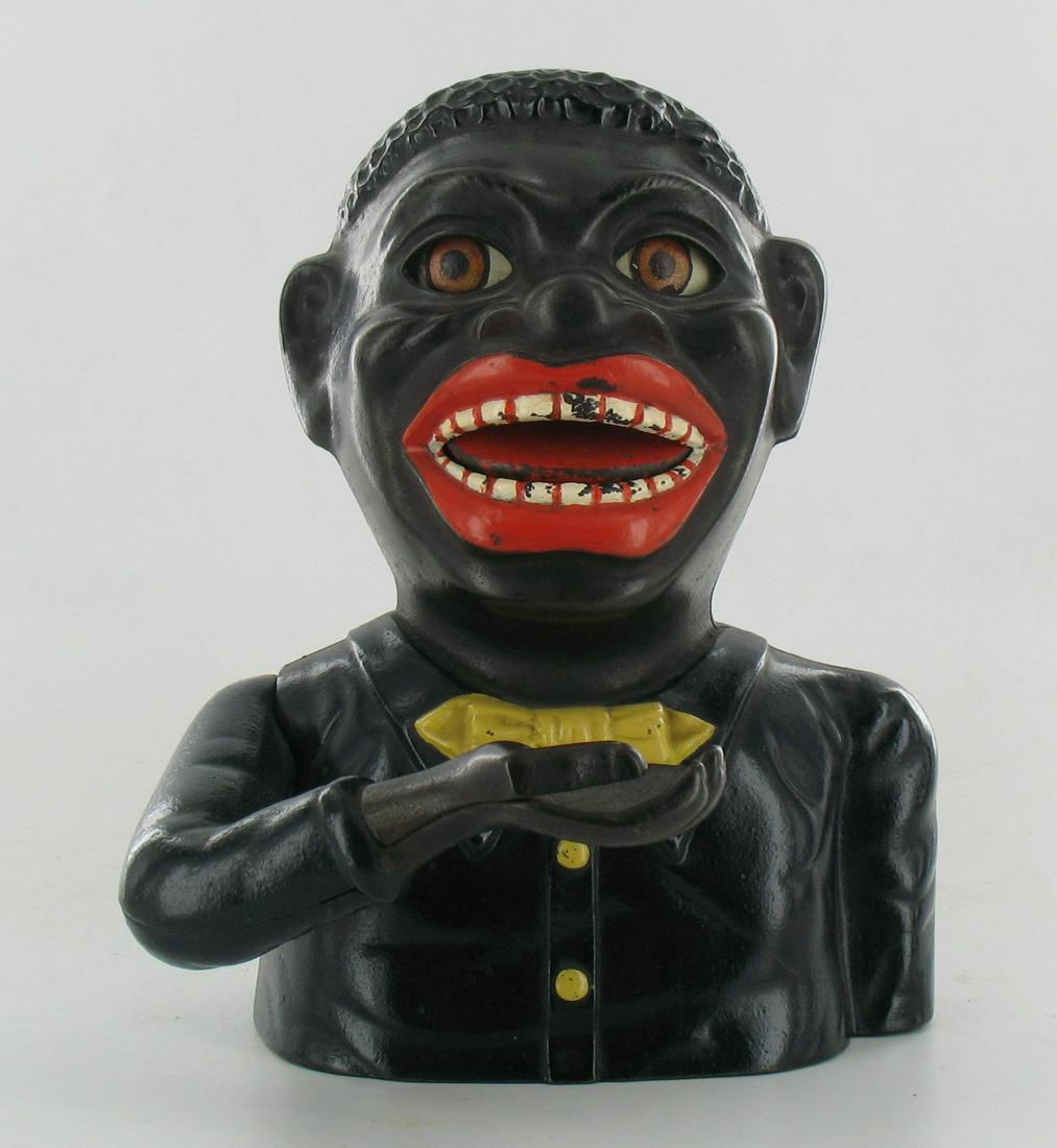 Jolly Man Very Dark Navy Blue Coat Mechanical Bank: Made by Shepard Hardware. Buffalo, New York. Cast Iron. Patent Mar 14, 1882 on back. Exceptional detailing to teeth and black eyebrows are present. An exceptionally fine example of this rare color var