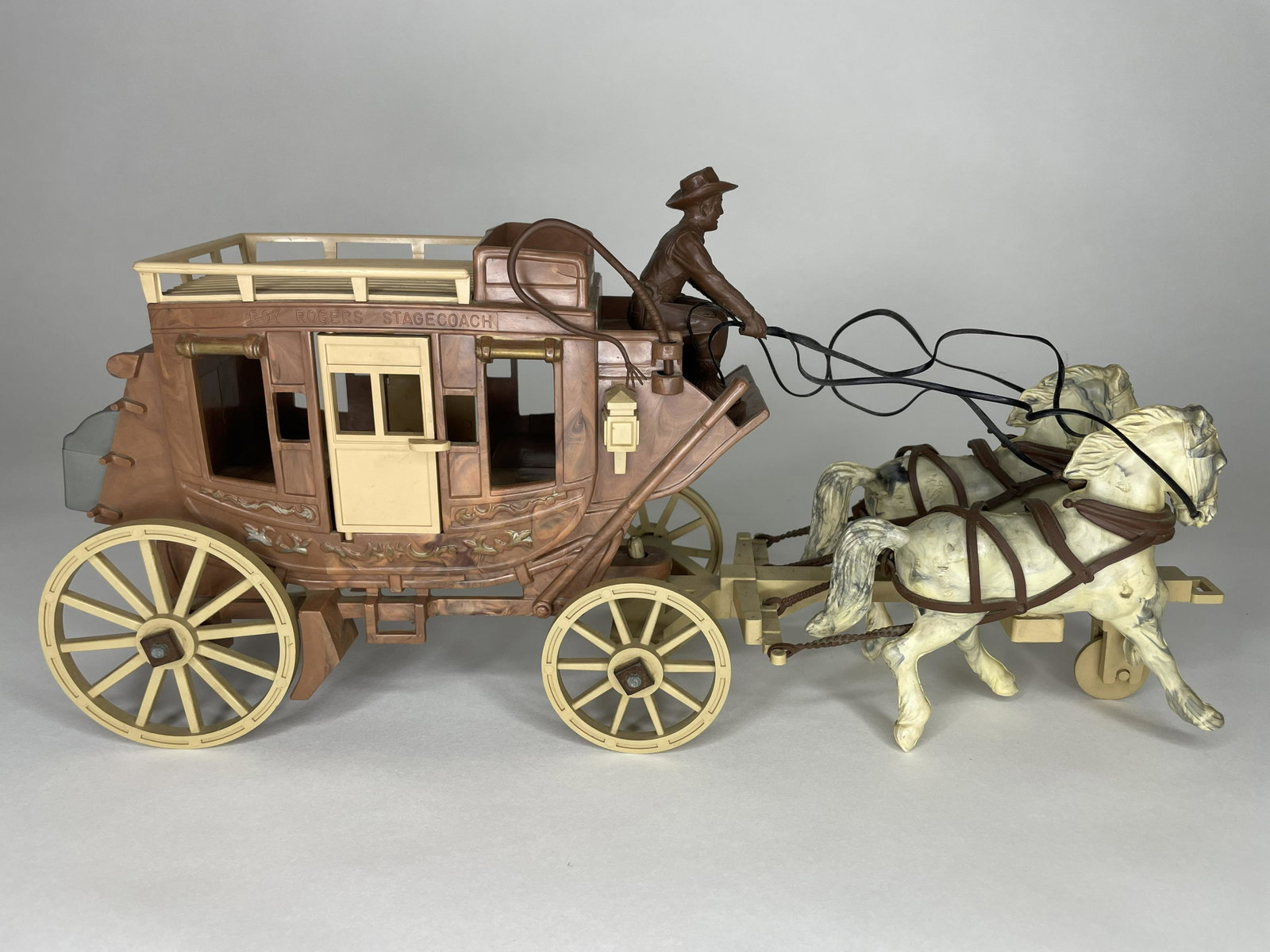 Stagecoach with Driver: Made by Ideal USA. Retains original wheel change kit. Measures 15 in length. Very Good Condition.