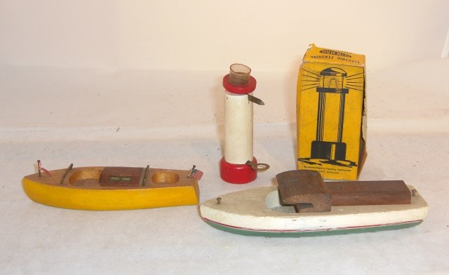 2 WOOD BOATS AND LIGHTHOUSE WITH BOX: Boats 6" & 5 1/4" long, lighthouse about 3" tall, "electric" but does not light; boats condition very good, lighthouse good, box poor