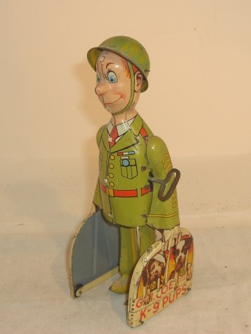 TIN WIND-UP G.I. JOE & K-9 PUPS: 8 3/4" tall; very good condition