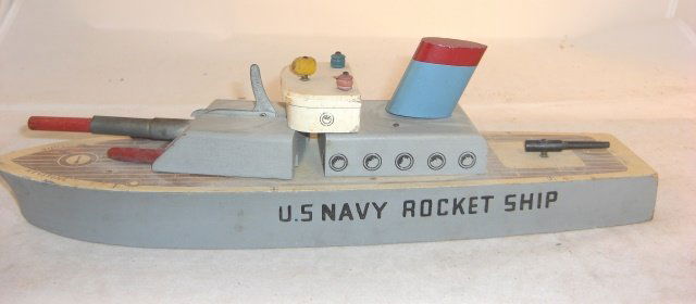 KEYSTONE "U.S. NAVY ROCKET SHIP": Wood; 14" long; rotating rocket turret w/rocket; spring not working; condition very good