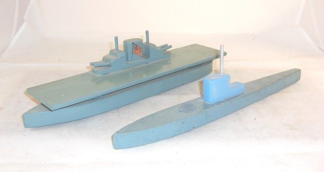 2 WELMADE SHIPS: Wood; ELASCO TOY CO.; submarine 14" long; aircraft carrier "U.S.S. HORNET" 14" long; both ships wheeled; condition very good