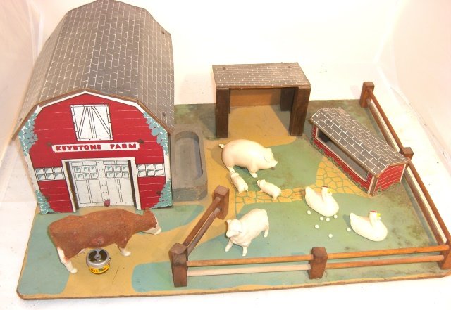 KEYSTONE FARM: No box; base 20" x 15 1/2"; includes composition cow (3" high, 5" long), pig & 2 piglets, sheep, 2 hens and 7 eggs; cow "drinks" by squeezing & gives "milk"; pig has magnet on bottom to attach piglets
