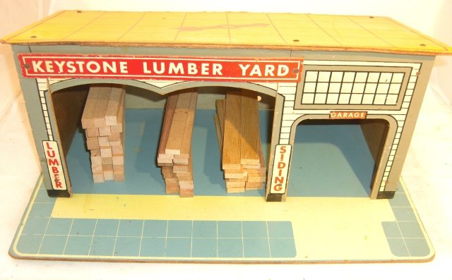 KEYSTONE LUMBER YARD: Wood with stacked wood pieces; base 18" x 12"; condition very good