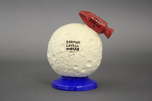 Apollo Still Bank: Apollo (4 1/4" H). Made of cast iron and in near mint condition with original box. The bank was made by John Wright of the United States circa 1968.