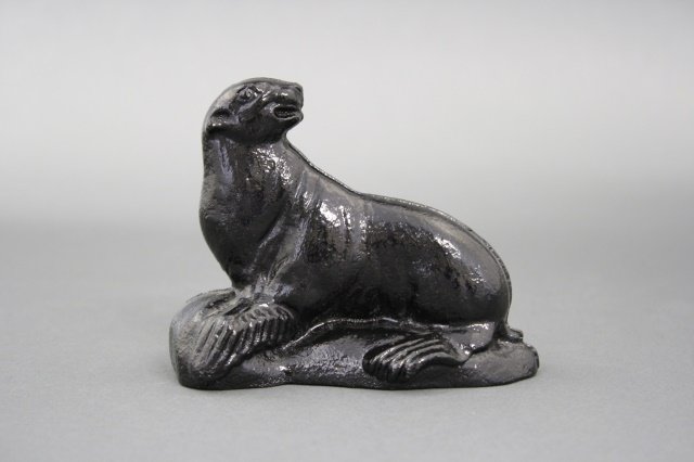 Seal on Rock: Seal on Rock (3 1/2" H). Made of cast iron and a complete repaint. Made by Arcade Mfg of. America circa 1920.
