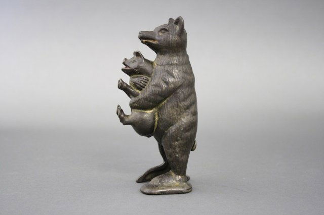Bear Stealing Pig Bank (1 of 2)