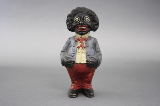 Golliwog Bank: Golliwog (6" H). Made of cast iron and is an old repaint. Made by John Harper Ltd of England circa 1910.