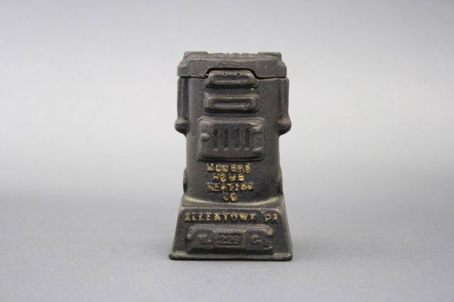 Mo-He-Co Furnace Bank: Mo-He-Co Furnace (4 1/4" H). Made of cast iron and in excellent condition. Made in the United States circa 1930.