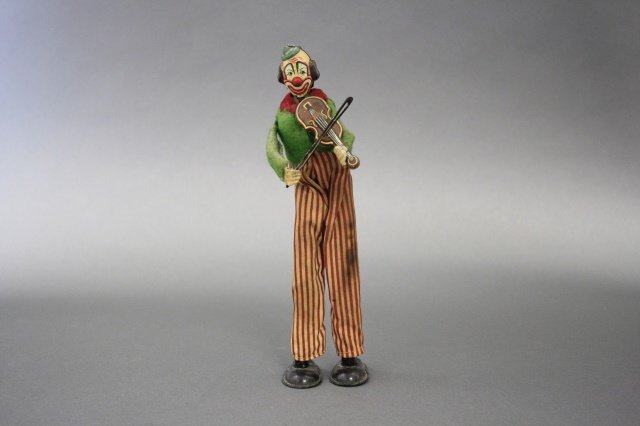 Tall Clown with Violin: The toy is 9" H. The toy works. Excellent Condition and made of tin/fabric. Made in Occupied Japan circa 1950.