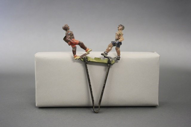 Penny Toy Articulated Boxers: The toy is 6" H. Pristine condition and made of tin. This penny toy was made at the time of the Max Schmeling / Joe Lewis heavyweight title fight of 1938. Made in Germany circa 1930.