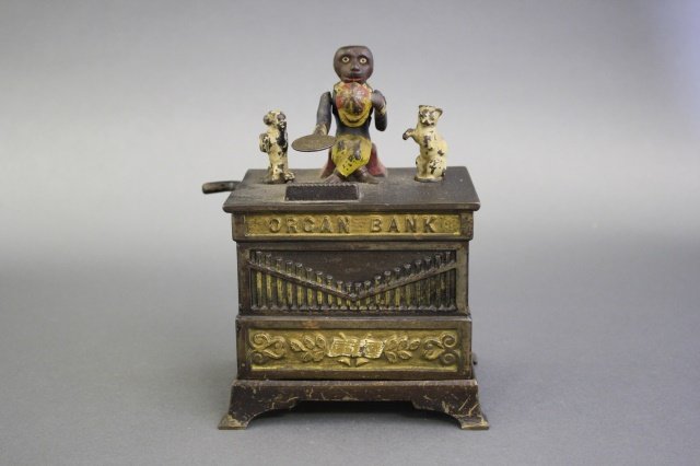 Organ Cat and Dog Bank: Made by J. & E. Stevens of America circa 1880. Made of Cast Iron. Very Fine Condition (crank replaced).