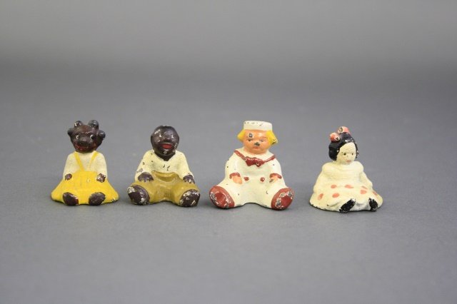 Four Seated People Paperweights (1 of 2)