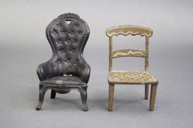 Two Cast Iron Chairs: American circa 1890. 4" - 5" H. Made of Cast Iron. Fine Condition.