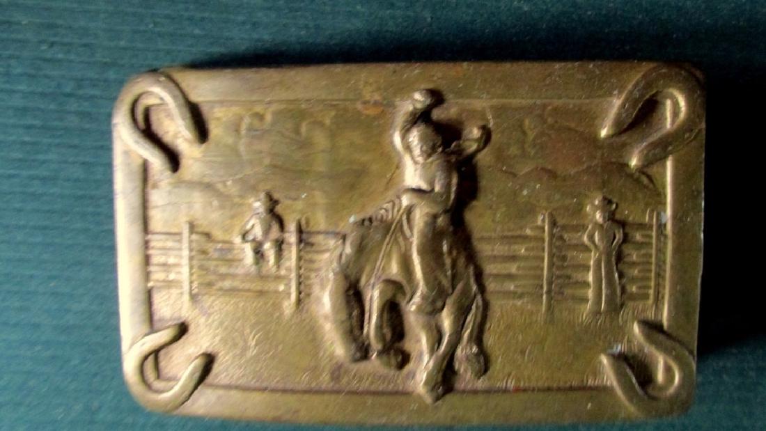 American Cowboy Belt Buckle: American Cowboy Belt Buckle with Bronking Horse and Horseshoe corners Date/Period: Circa 1930