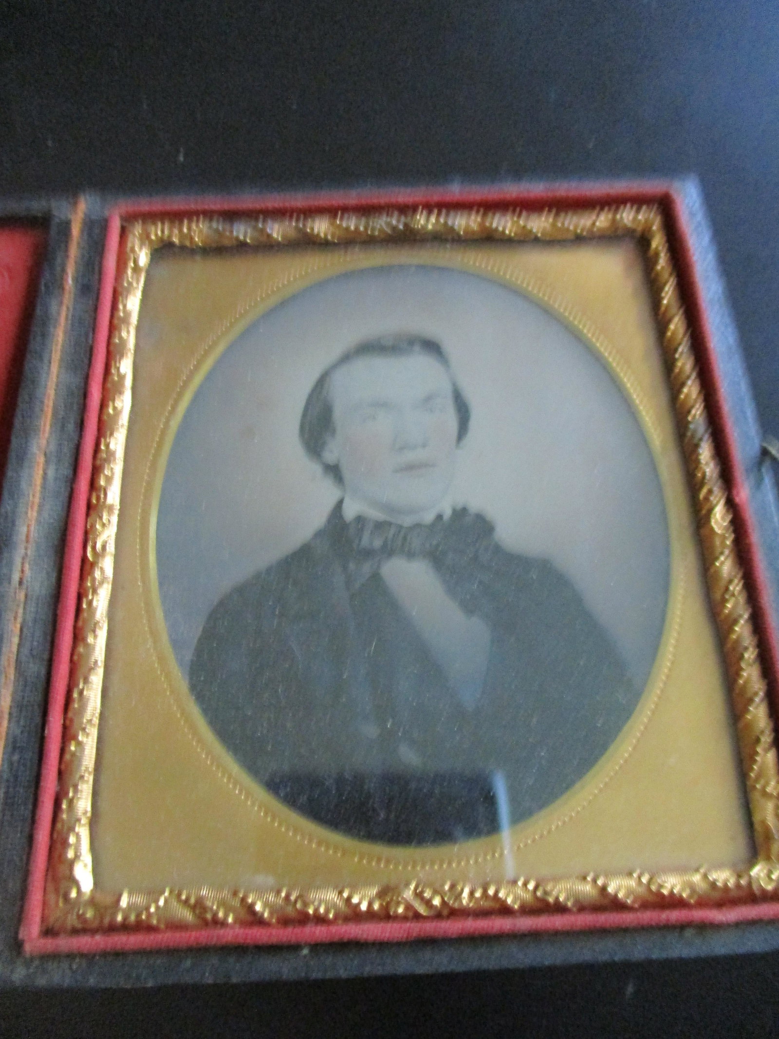 Ambrotype Portrait of a Gentleman: Portrait of a Gentleman Impressed Decorated case. Mount is beautifully decorated and gilded. The image is fine. A beautiful example. Geometric impressed red cushi