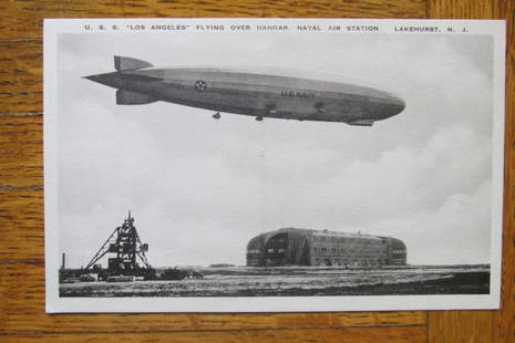 USS Los Angeles Naval Air Station Lakehurst NJ: U.S.S. Los Angeles flying over Hanger Naval Air Station, Lakehurst, N.J. Published by the Airship Photo Service, Lakehurst, NJ. Rare. Dated: Circa 1930's Type/Theme: Military Airships Size: