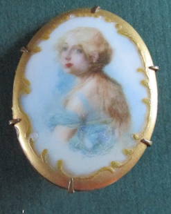 Lady In Blue Brooch: Lady in Blue Brooch Painted on porcelain. Mounted on brass oval back. Origin: American Date/Period: 19th/20th Century Type: Brooch Dimensions: 1 3/4" Provenanc