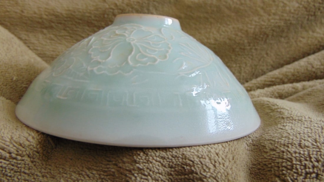 Chinese Celadon Incised Bowl: Chinese Celadon Bowl Incised with brown unglazed foot. Origin: China Type: Celadon Dimensions: Top Rim 5" Foot 1 1/4" Condition Report No defects noted