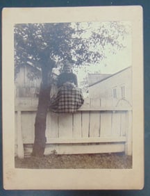 Unusual Photograph of Woman On Fence