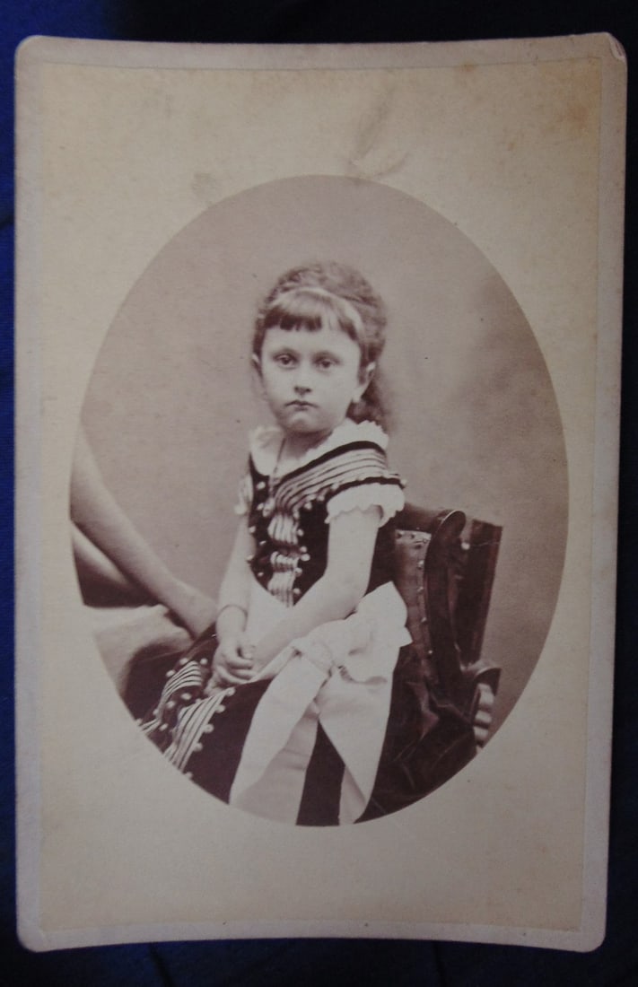 Sad Girl - Joseph Kirk Photographer: Sad Girl 19th century American Photographer. 661 Broad, Newark, NJ. An unusual image of a sad girl nicely dressed for her special photograph. Great photograph with back graphics Photographer: Jose