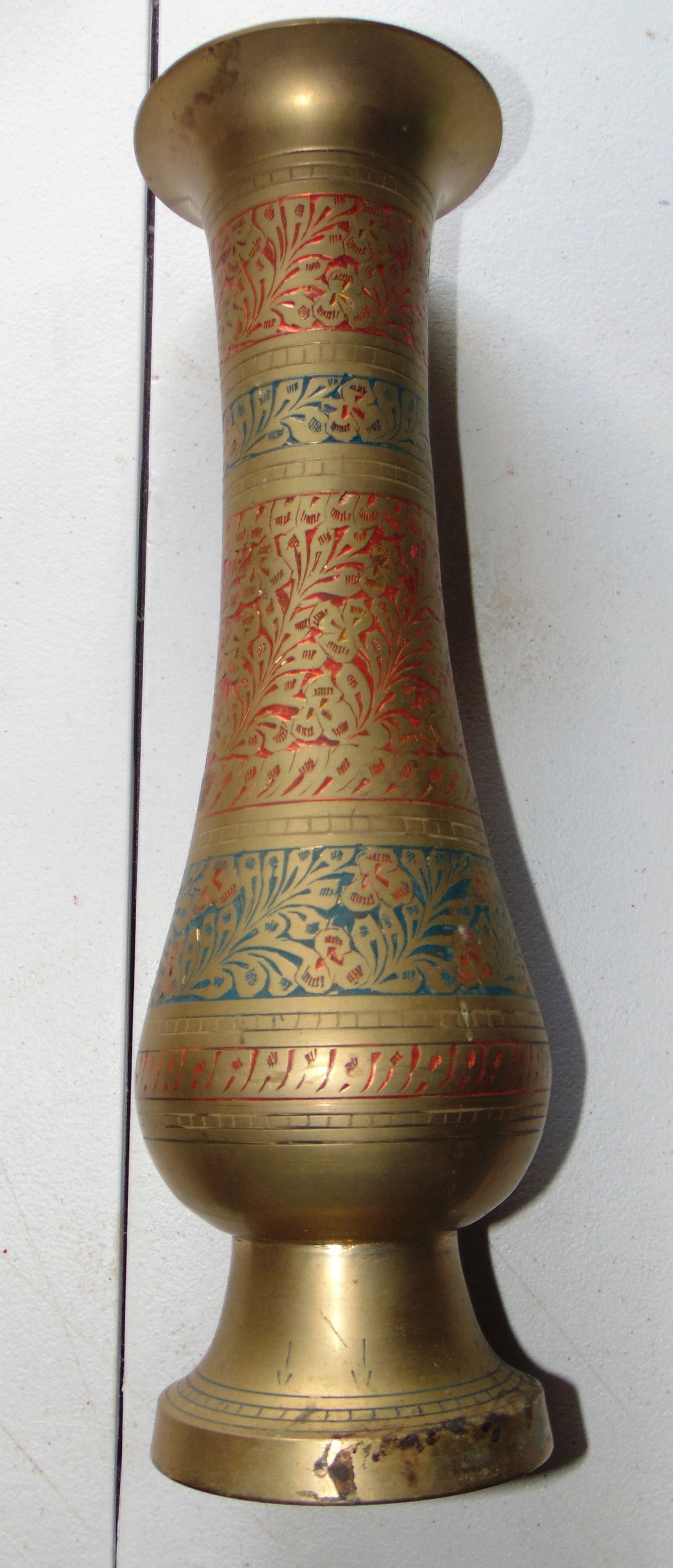 A Tall Brass Vase: A Tall Brass Decorated Incised Vase Dimensions: H 14" W at base 4" Condition Report Some blacking on base. See pictures. Needs cleaning.