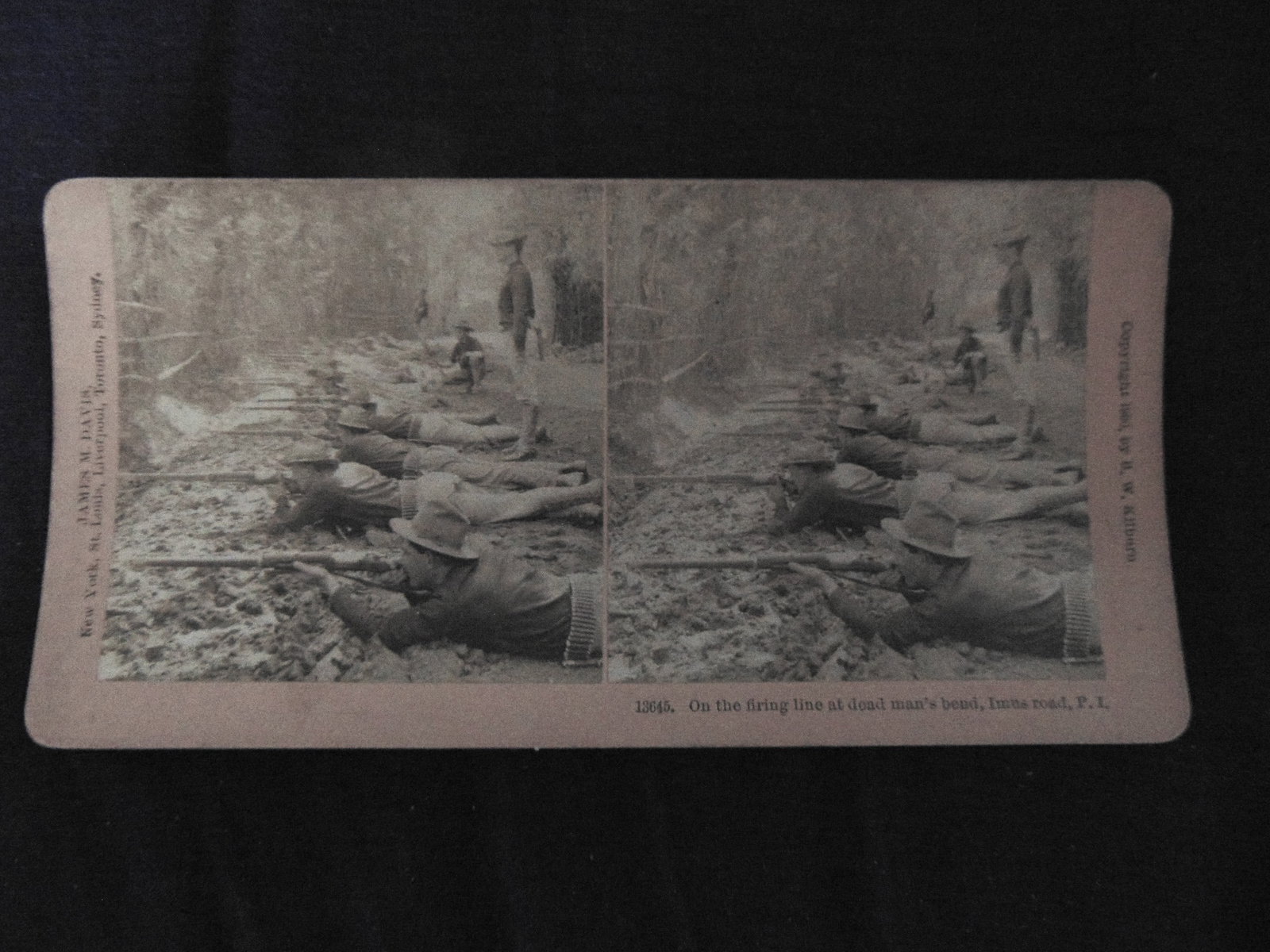 On The Firing Line - Imus Rd. Philippine Islands: On The Firing Line at Dead Man's Bend - Imus Rd. Philippine Islands Photographer: James M Davis Dated: 1900 Medium: Stereoview Provenance: Hill House Photograpy Collect