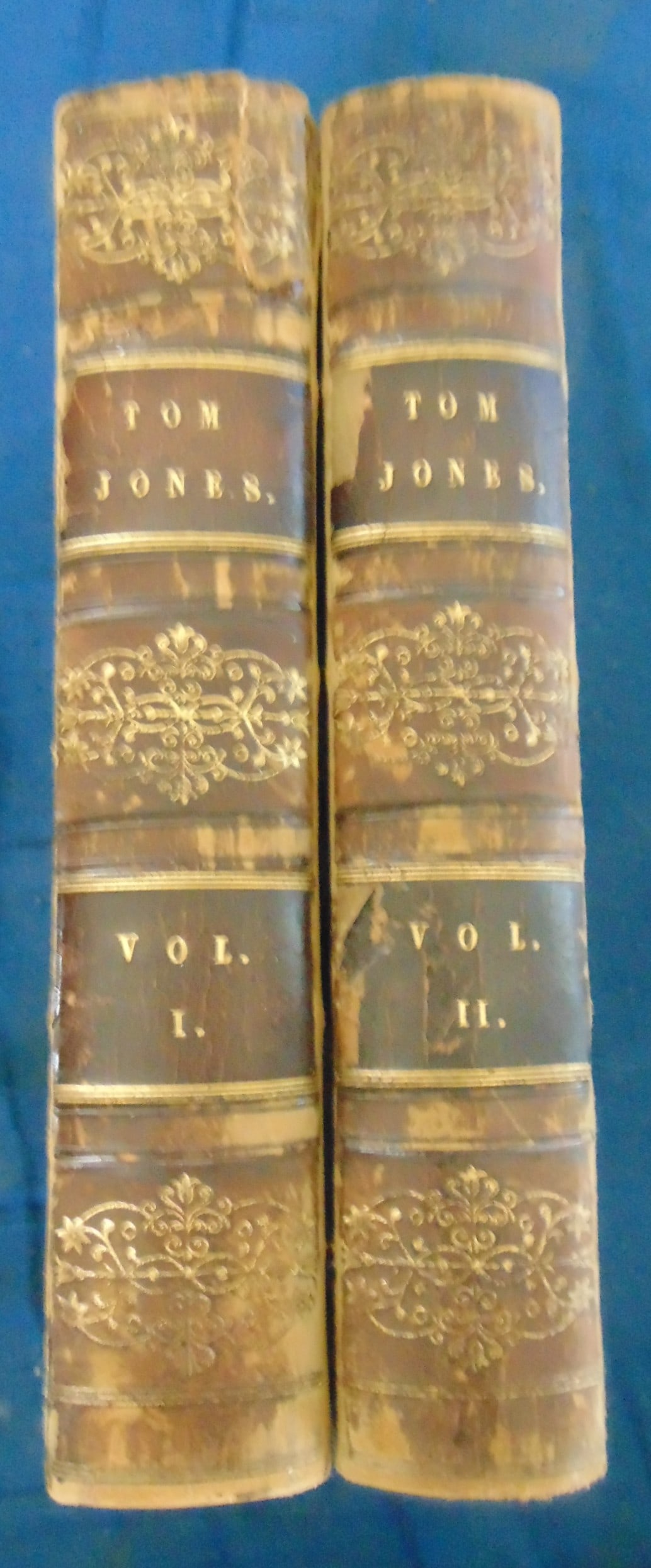 Tom Jones (2 Volume Set) 1831: Tom Jones 2 Volume set. Author: Henry Fielding Dated: 1831 Publisher: James Cochrane Size: 12mo Binding: Quarter Leather Type: Literature - Classics Provenance: Hill House Rare Book Collection 