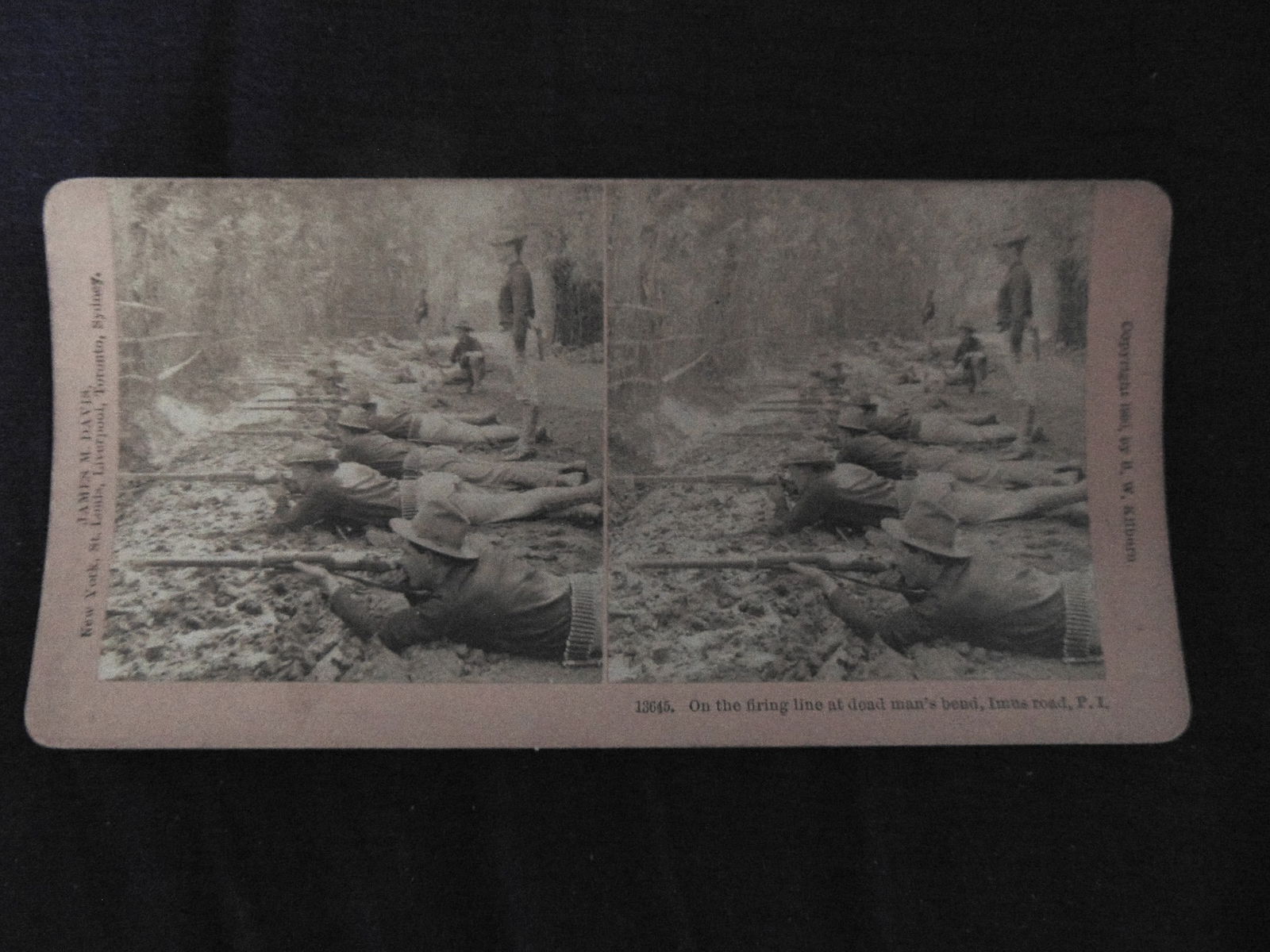 On The Firing Line - Imus Rd. Philippine Islands: On The Firing Line at Dead Man's Bend - Imus Rd. Philippine Islands Photographer: James M Davis Dated: 1900 Medium: Stereoview Provenance: Hill House Photograpy Collection Condition Report Very