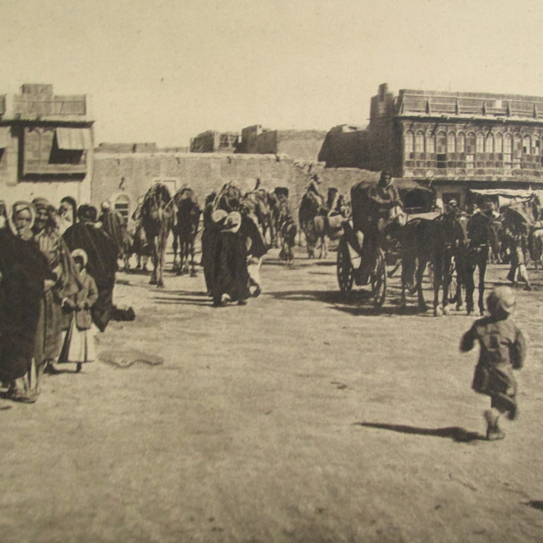 Bazar Square - Basrah City - Iraq: Bazar Square - Basrah City - Iraq With Plate Mark. Photographer: Attributed to A. Kermin Dated: c1925 Medium: Fine photogravure Dimensions: 9 1/2 x 11 Country/Origin: Iraq Condition Report Very