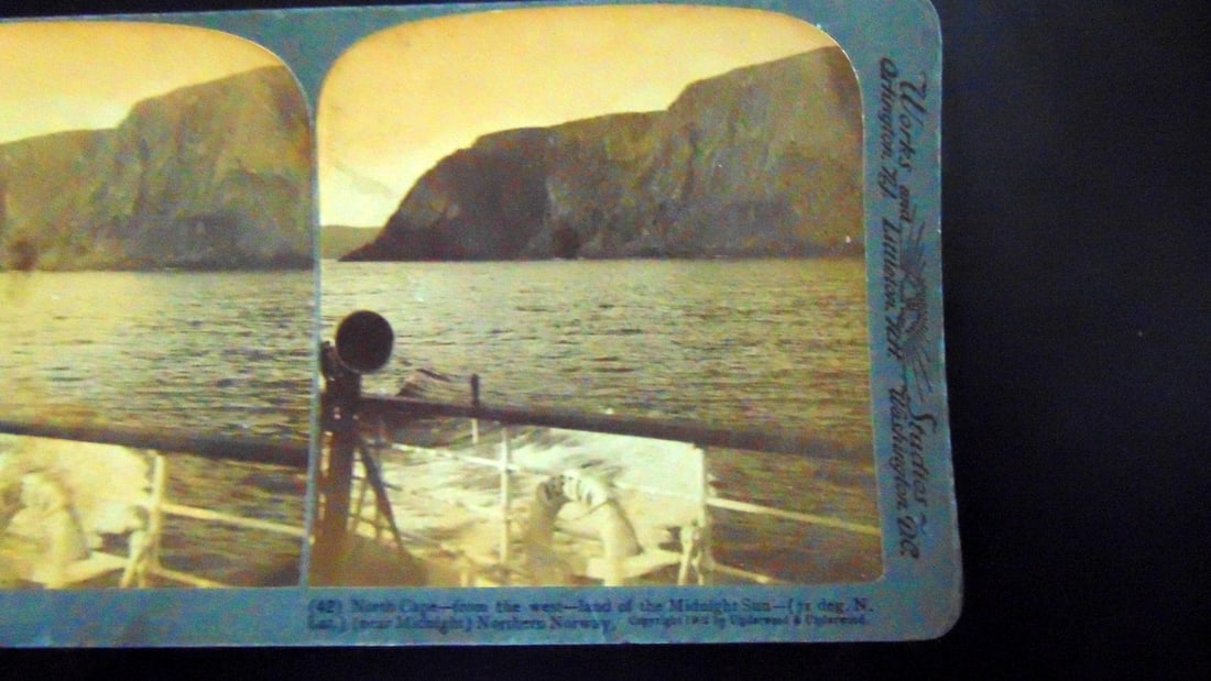 North Cape - Land of the Midnight Sun - Norway: North Cape From The West (71 degrees North Latitude) Near Midnight Northern Norway Photographer: Underwood Dated: 1902 Medium: Stereoview Condition Report Toning. Good <