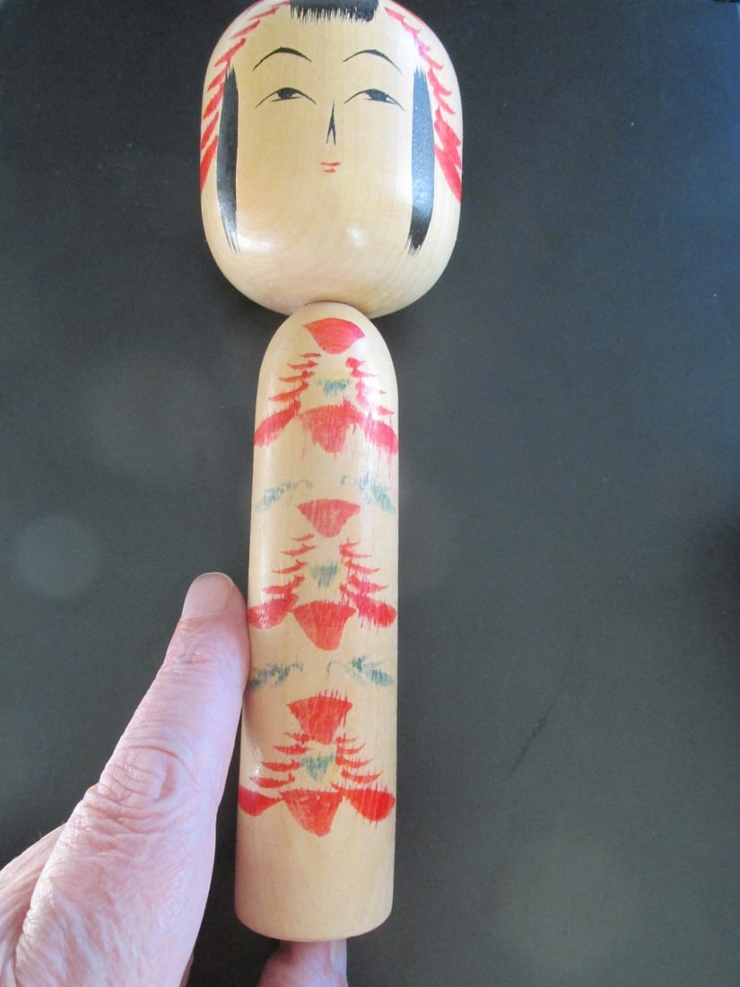 Japanese Kokeshi Doll - Signed: JapaneseSakunami Kokeshi Doll - Signed on base Origin Japanese Dimensions: H 7 1/2" Condition Report No defects noted.