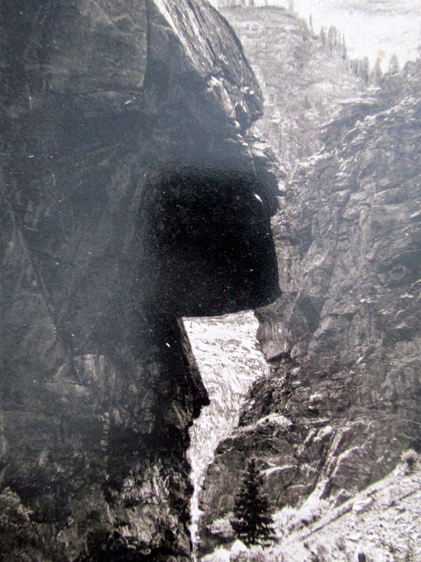 Clear Creek Canon - William Henry Jackson: Clear Creek Canon - The Hanging Rock From Photography by W. H. Jackson printed in Denver. Photographer: William Henry Jackson Dated: (1893) Subject: <