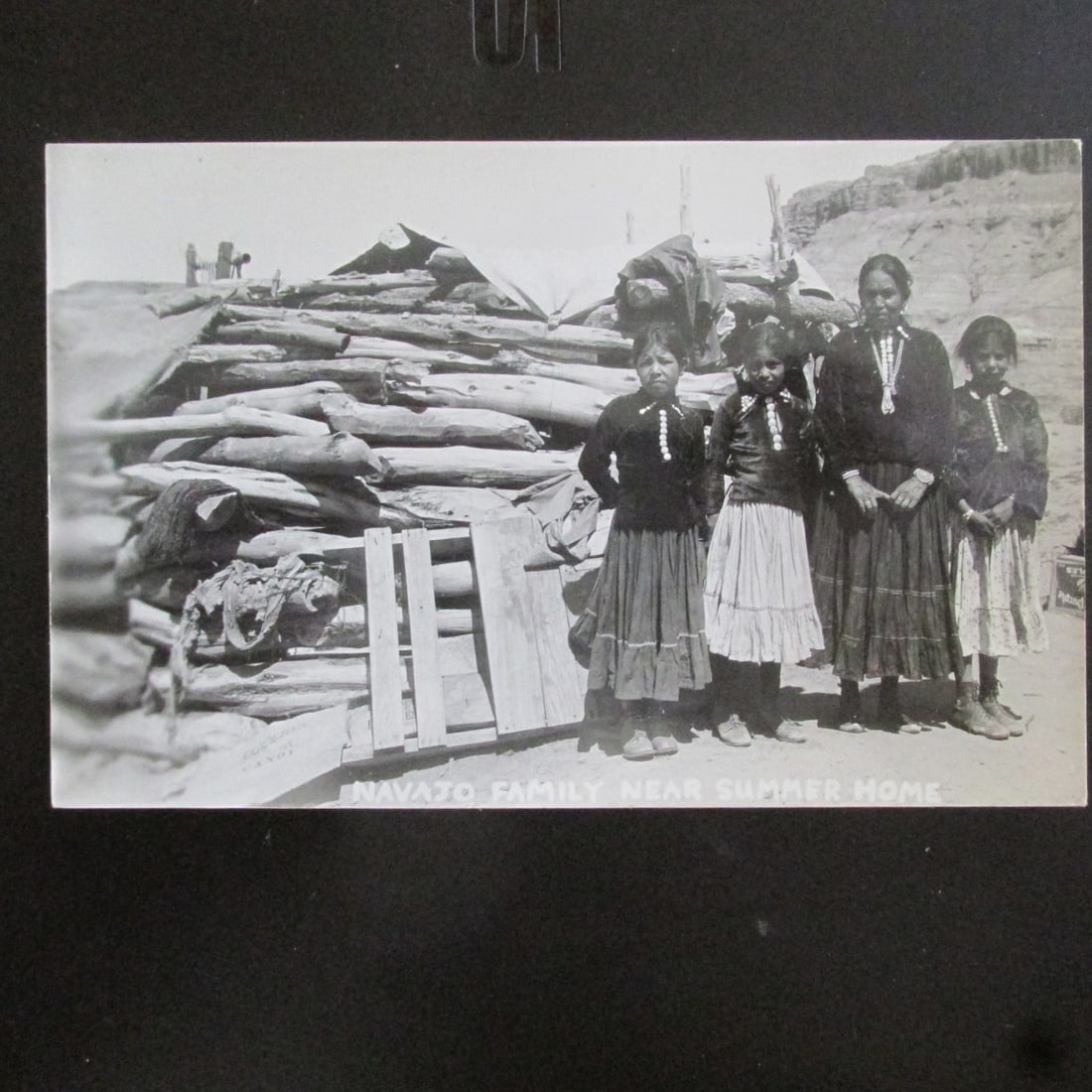 Navajo Family Near Summer Home: Navajo Family Near Summer Home Navajo Reservation - RPPC. Photographer Unkown Dated: c1929 Type/Theme: American Native Indians Provenance: <