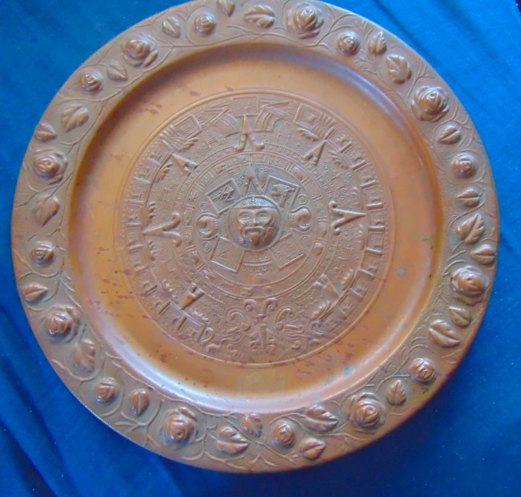 Mayan Aztec Calendar Copper Charger: Mayan Aztec Calendar Copper Charger With Rose & Bud border Wall Hanger. The Mayan and Aztec calendars were not just ways to mark time; they were deeply integrated into every aspect of life, from agric