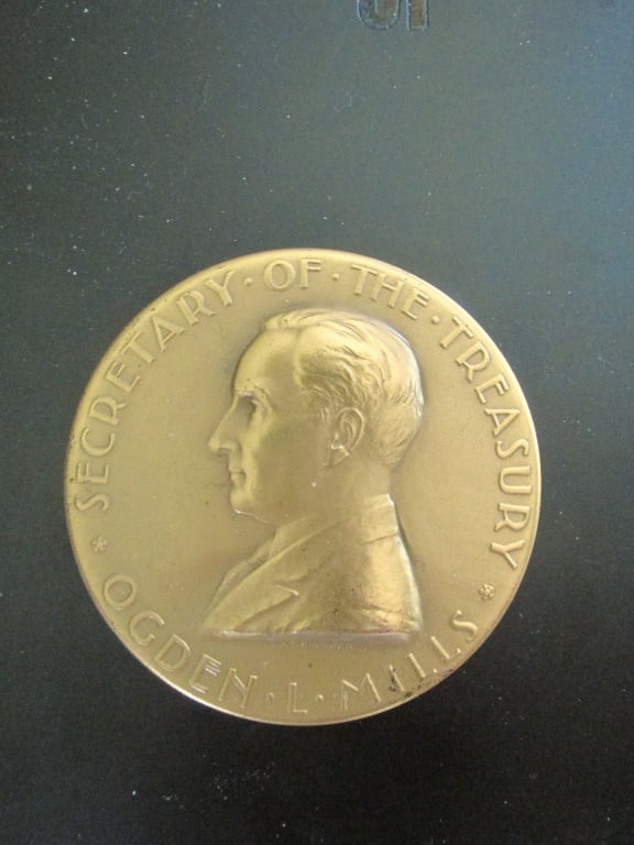 Ogden L. Mills Medal Bronze Medallion: Secretary of the Treasury Ogden L. Mills Medal Bronze Medallion Beautiful quality surfaces exhibit an overall smooth, golden-bronze appearance on both sides. Artist
