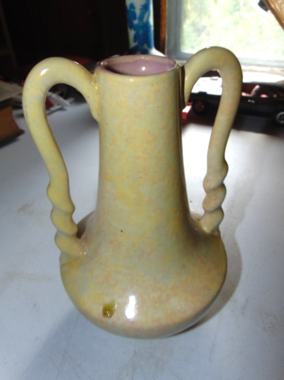 Gonder Twisted Handle Yellow Vase: Gonder Twisted Handle Yellow Vase Low H-5 number Dimensions: 9 x 5" Condition Report Hairlines at top handle. Glaze flaw.
