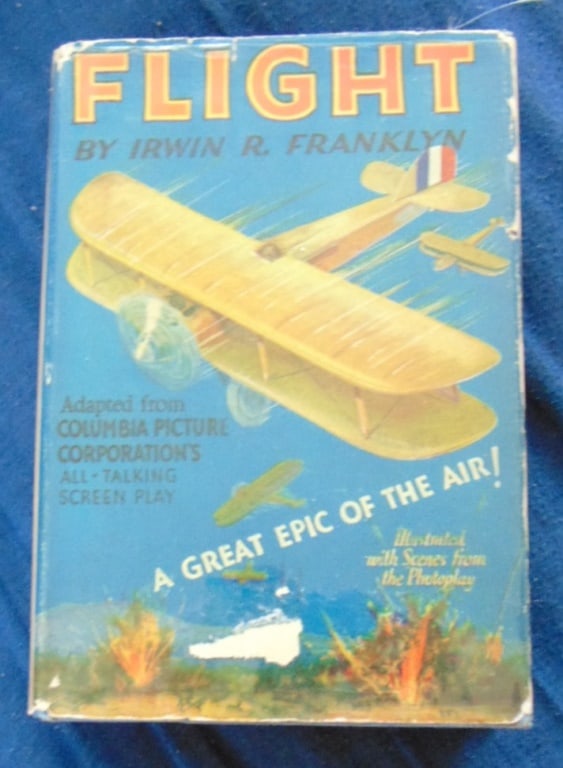 Flight - Columbia Picture Photoplay w/ DJ: Flight - A Great Epic of the Air! Adapted from Columbia Picture Corporation's All Talking Screen Play All Photos Present. Dust wrapper is in clear archival sleeve. Columbia Picture directed by Frank R