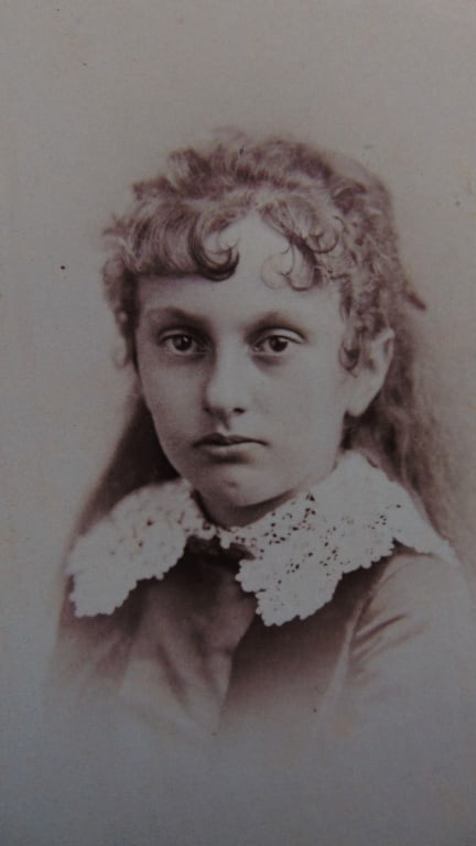 Portrait of a Young Girl - Napoleon Sarony: Portrait of a Young Girl **Napoleon Sarony, a master of photographic portraiture, was renowned for his stunning images of high society and celebrities. However, his lens also captured the innocence of