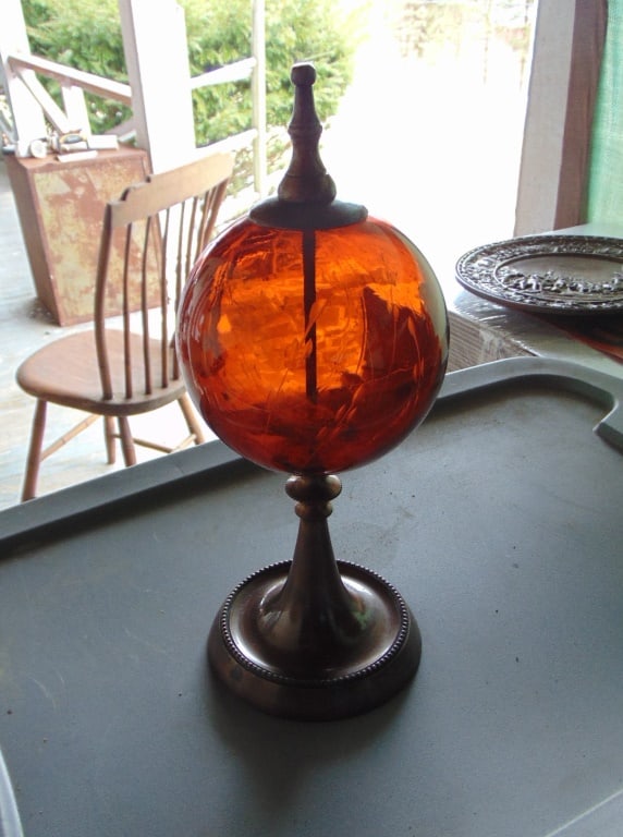 Amber Etched Glass Ball on Pedestal: Amber Etched Glass Ball on Pedestal Dimensions: 13 x 4/1/2" Condition Report Some Verdigris. Felt base. Good
