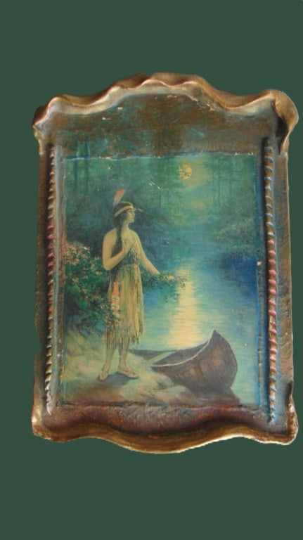Nokomus - Daughter of the Moon (Indian): Nokomus - Daughter of the Moon (Indian) Depicts a Native American woman standing next to a canoe, with the title "Nokomis" and the Knapp Company information printed below the image. This print is from