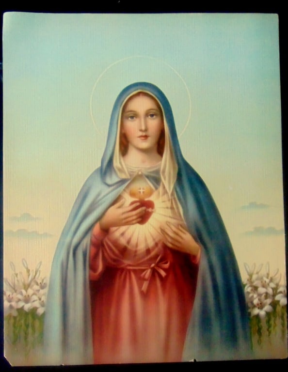 Mary with Sacred Heart: Mary with Sacred Heart The image of Mary holding a pierced, flaming red heart is a representation of the Immaculate Heart of Mary. It is a Catholic devotion that emphasizes Mary