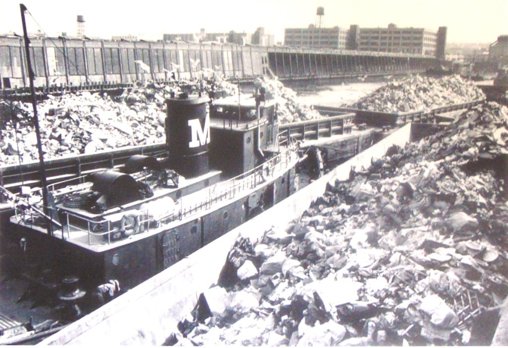 Barges Taking Waste to Fresh Kills Landfill: Barges Taking Waste to Fresh Kills Landfill Plate 41 Photographer: Wendy Holmes Dated: 1970's Subject: Hudson River Valley Medium: Halfto