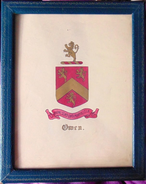 Owen Family Crest and Banner Hereldery: Owen Family Crest and Banner Honestas Optimapolitia. Using gold letters and decorations on a darker red background. In dark green letter fame with back stand. Medium: Pen & Ink Gouache Date: